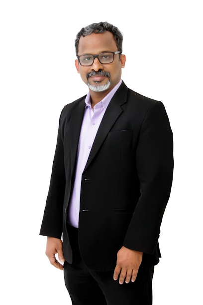 Dr Shaju George