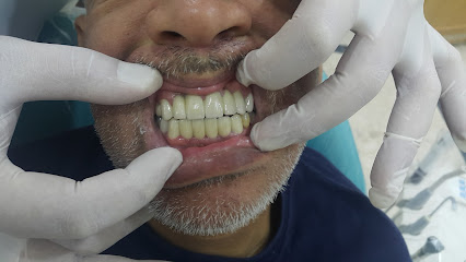 د احمد الثلجة طبيب اسنان